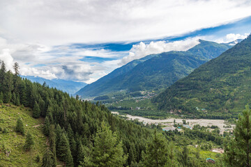 View of mountains and valleys of manali and beas river near Jogini waterfall in Himachal Pradesh India.