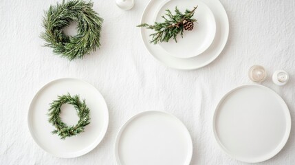 Minimalistic Christmas table setting with pine wreaths