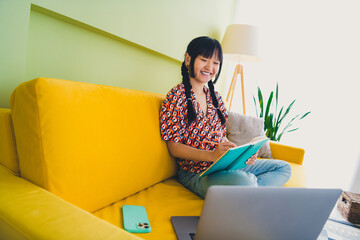 Full size photo of pretty young woman notepad laptop couch weekend modern interior apartment indoors