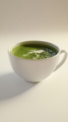 Steaming white cup holds a hot, vibrant green matcha latte.