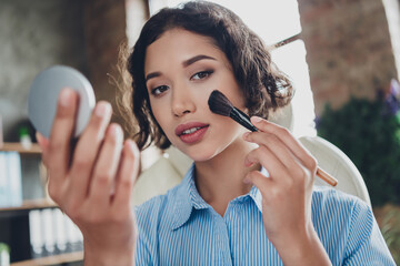 Photo of cheerful positive lady recruiter dressed shirt applying makeup skin tone indoors workplace...