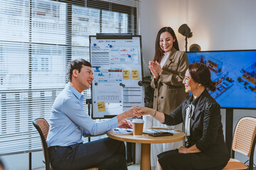 Professional asian business team women and gay hand shake with partner in office to business deal teamwork concept