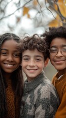 Fototapeta premium Three children share joyful smiles during a playful moment in a park setting