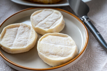 Rocamadour or cabecous soft goat AOC cheese with soft rind produced on farm in Perigord and Quercy on farmers market, departement Lot, France