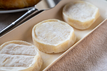 Rocamadour or cabecous soft goat AOC cheese with soft rind produced on farm in Perigord and Quercy on farmers market, departement Lot, France