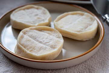 Rocamadour or cabecous soft goat AOC cheese with soft rind produced on farm in Perigord and Quercy on farmers market, departement Lot, France