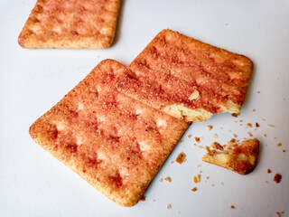 Biscuits flavoured with abon sapi or shredded beef, namely dried beef flakes, isolated on a white background.with batter crumbles 