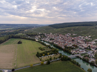 Panoramic aerial view on green premier cru champagne vineyards and fields near village Hautvillers...