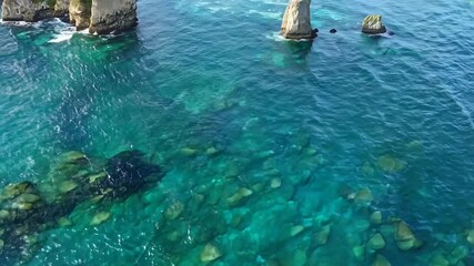 collection nature nestled juxtaposed water rocks view sea body aerial beauty showcasing AIjagged crystal-clear tranquil rock calming landscape outdoors environment scenery waterfront aquatic soothing