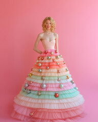 Fototapeta premium A portrait of an irresistible and confident girl wearing a dress made of Christmas baubles, standing in front of a solid background, with vibrant and cheerful colors in the spirit of New Year's