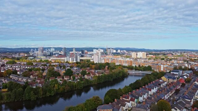 Aerial drone footage of the Grangetown district in Cardiff, Wales with River Taff running through it. Pedestal up shot.