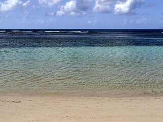 Paradise tropical beach background with turquoise lagoon, horizon over the sea, sunny weather and...