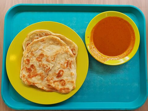 Asian food roti canai prata. Malaysia traditional food roti canai prata with curry . Asian food concept