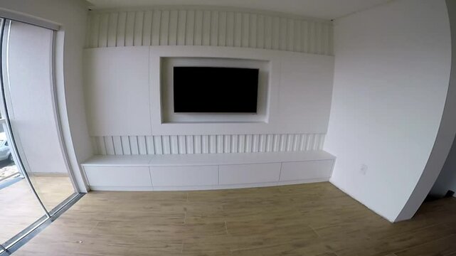 sala de estar com ripado branco e televis&atilde;o 