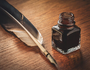 Close-Up of a Feather Pen with Ink Bottle on a Wooden Desk