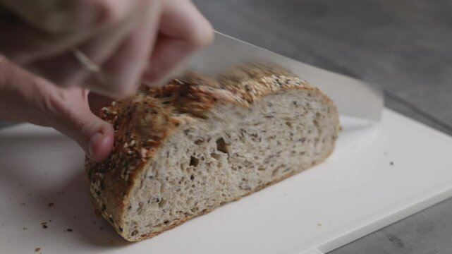 slicing home made piece of bread 