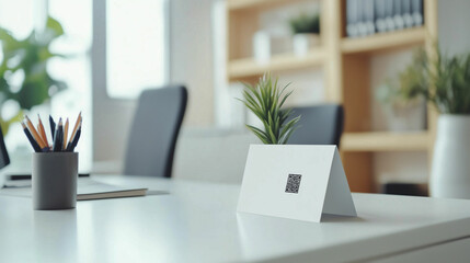 Fototapeta premium Showcase of an office ID card mockup displayed on a minimalist desk setup with greenery and stationery in an airy workspace