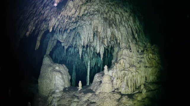 A cave with a large rock in the middle