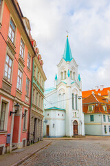 Obraz premium Old street in old Riga. The city is capital of Latvia that is well known to be a very popular tourism destination in the Baltic region