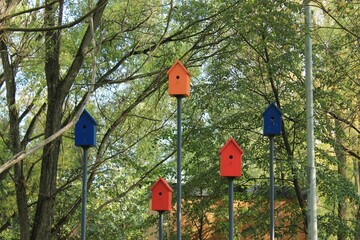 Beautiful colorful birdhouses in the city park. Moscow. Russia.