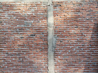 antique brick wall background, red brick surface of house wall