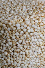 Closeup of popped quinoa in glass jar
