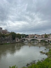 Fototapeta premium Waterfront city and bridge Rome