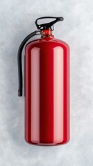 Obraz premium Fire extinguisher mounted on a concrete wall in a warehouse, showcasing fire safety equipment for emergency preparedness