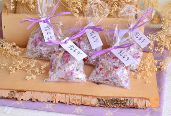 Wedding favor bags scented sachets bath salt purple color wood background ribbon custom label with...