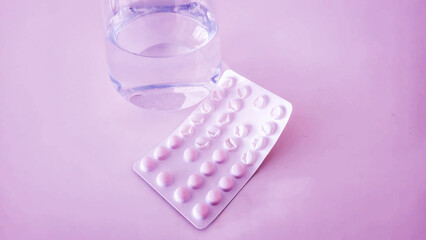 Colorful vitamin pills in a bottle on an isolated background 