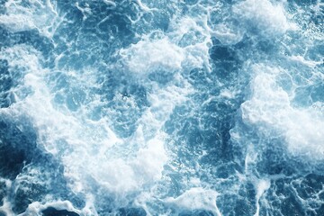Obraz premium View from above of blue sea waves, white foam, top view