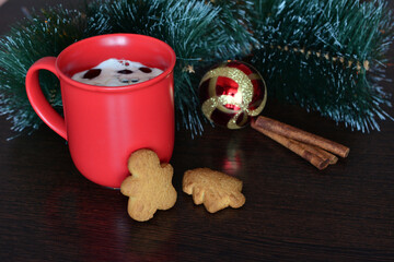 a christmas tree with a red cup of coffee and gingerbread cookies   