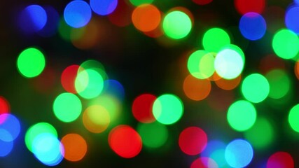 abstract christmas background: vibrant, glowing Christmas lights captured in bokeh style, creating a festive, dreamy effect, colorful lights in soft focus, ideal for holiday themes and backgrounds