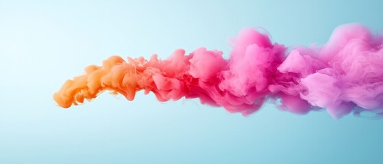 Fototapeta premium A collection of colorful smoke clusters suspended against a blue backdrop, featuring a gentle light blue sky in the distance