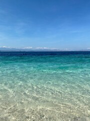 Beach view with blue clear water on an small tropical island