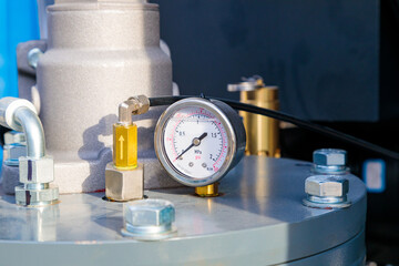 Pressure gauge measuring pressure in industrial pipeline system