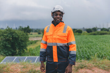 Engineer Checking solar panels in agriculture farm land. Engineer examining solar panels at field. Technicians maintenance solar photo voltaic panels  in agriculture farm field. clean energy