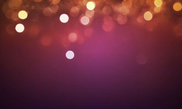 Soft bokeh lights create a warm atmosphere with purple hues during a lively evening celebration
