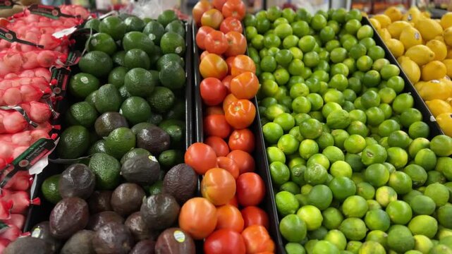 vegetables in supermarket. Medium tracking shot of vegetables in a grocery store