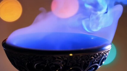 blue smoke lights Lit colorful rising burner incense bokeh background infuriated red light calming aromatic fragrant peaceful serene relaxation meditation spiritual ambience atmosphere aethereal tran