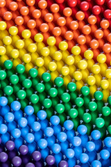 Playful Concepts: Pride colored figurines in diagonal rows
