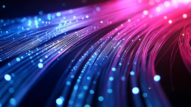 Colorful fiber optic cables with glowing blue and pink lights on black background