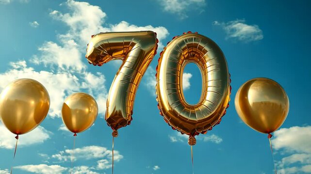 Golden 70 balloon celebration against blue sky. festive milestone and birthday concept