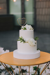 Merry cake in rustic style, boho against the backdrop of a romantic merry arch under the open sky