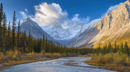 A winding river flows through a valley surrounded by snow-capped mountains and a forest with fall foliage.