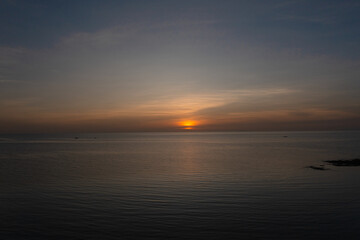 Naklejka premium Serene view of sea surface with sunset background. Sunset in Bantayan, Madridejos, Cebu. Philippines.