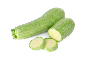 Fresh whole and cut zucchinis isolated on white, above view