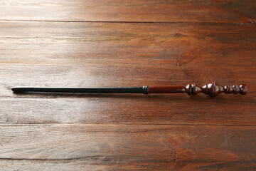 One old magic wand on wooden table
