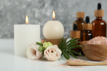 Spa composition with cosmetic products on white table