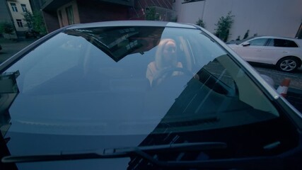 Focused Caucasian woman female girl auto driver rental service client carefully driving automobile steering wheel parking car buying vehicle rent transportation drive outdoors city street late evening